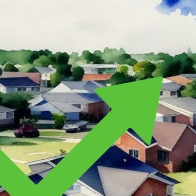 a green arrow pointing up to houses and cars