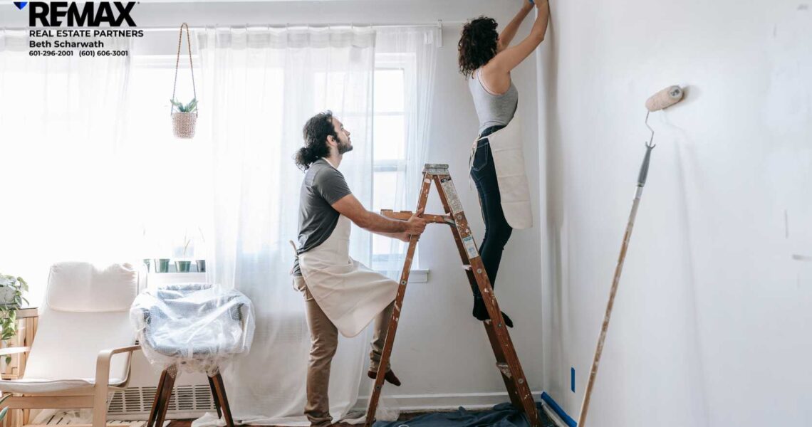 couple painting interior room