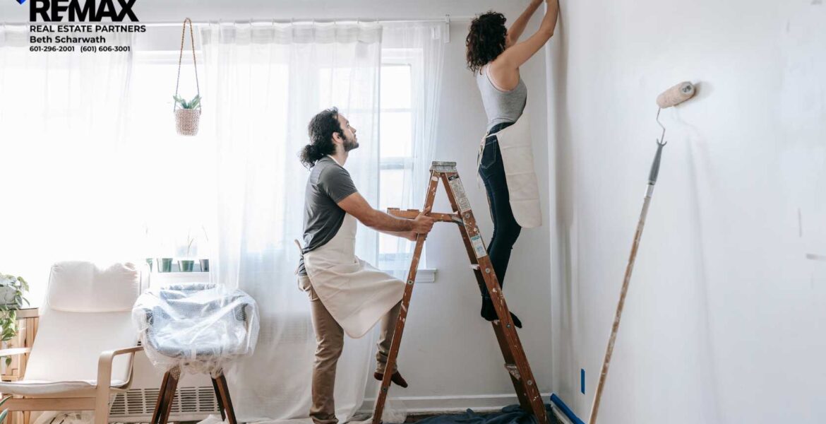 couple painting interior room