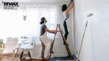 couple painting interior room