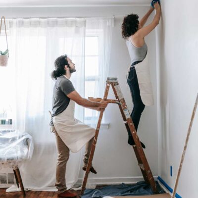 couple painting interior room