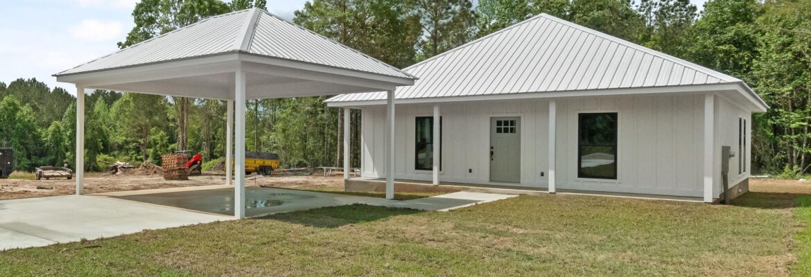 a white house with a lawn and Little White House with a white roof