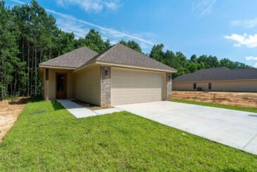 New one-story brick home with covered front porch, 56 Riviera Dr, The Chateaus of Le Papillon, Hattiesburg MS