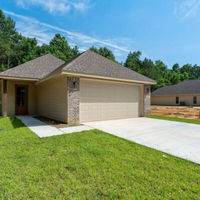 New one-story brick home with covered front porch, 56 Riviera Dr, The Chateaus of Le Papillon, Hattiesburg MS
